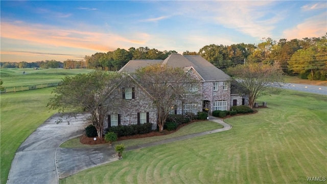 3610 Harbor Ridge Way, Tuscaloosa, AL 35406 - colonial home featuring a lawn, stone siding, and concrete driveway