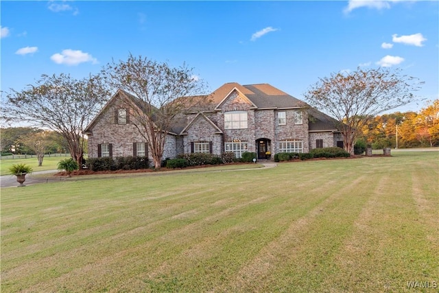 3610 Harbor Ridge Way, Tuscaloosa, AL 35406 - view of front facade featuring stone siding and a front lawn
