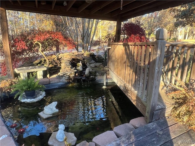 view of yard featuring a garden pond