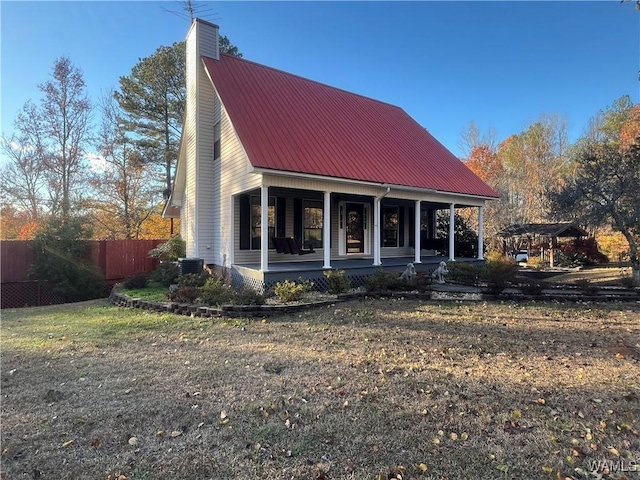 view of front of home with covered porch and central AC unit