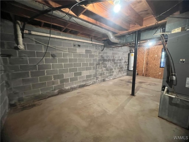 basement featuring heating unit and water heater