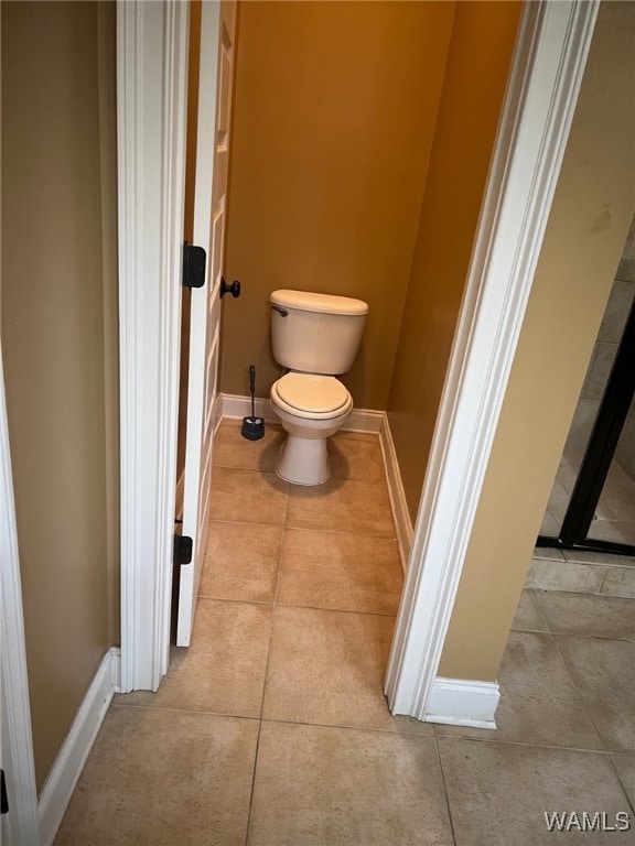 bathroom with tile patterned flooring and toilet