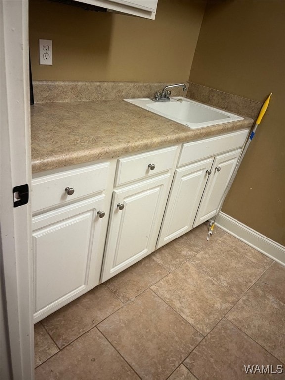 bathroom with tile patterned floors and sink