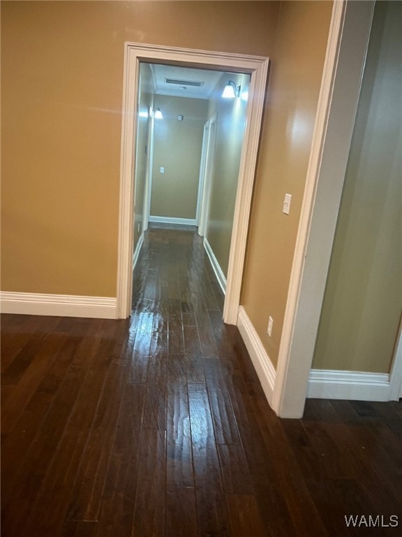 hallway featuring dark hardwood / wood-style floors