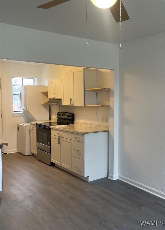kitchen with open shelves, stainless steel electric stove, under cabinet range hood, and a ceiling fan