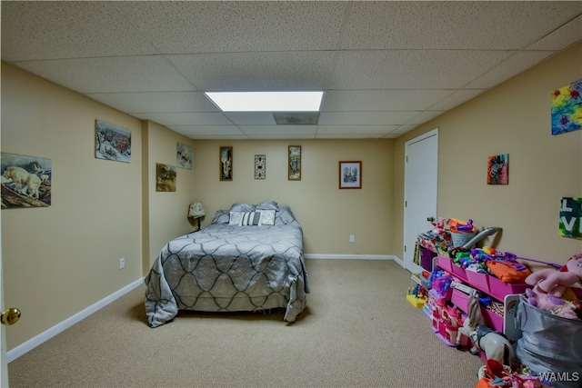 bedroom with carpet and a drop ceiling