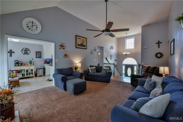 tiled living room featuring high vaulted ceiling and ceiling fan