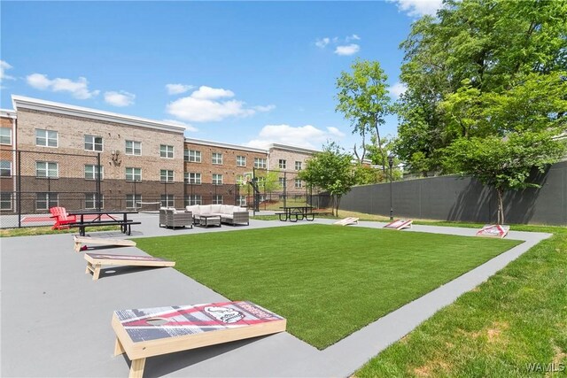 680 6th Ave NE Unit 3205, Tuscaloosa, AL 35404 - view of property's community featuring a lawn, an outdoor hangout area, and fence