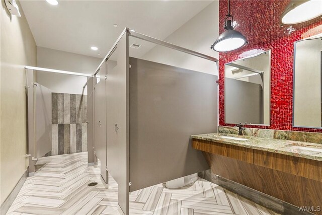 680 6th Ave NE Unit 3205, Tuscaloosa, AL 35404 - full bath with baseboards, double vanity, and a sink