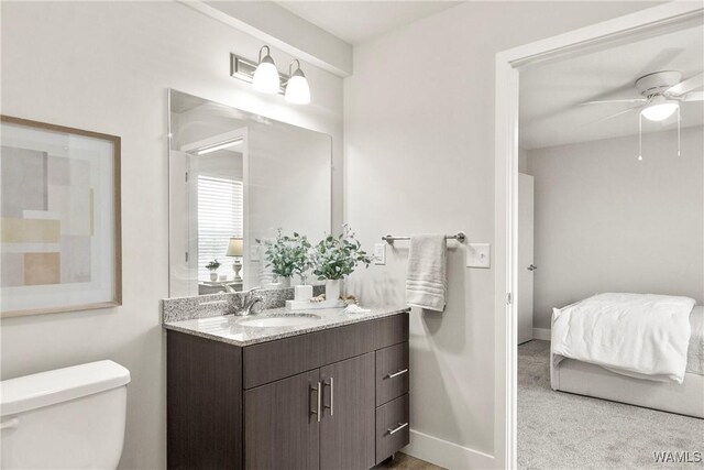 680 6th Ave NE Unit 3205, Tuscaloosa, AL 35404 - bathroom with baseboards, ceiling fan, toilet, and vanity