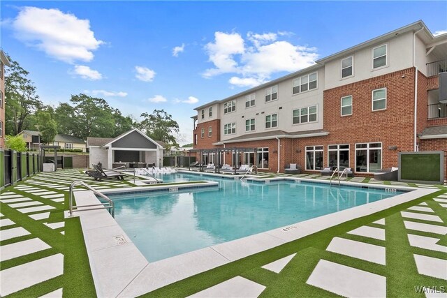 680 6th Ave NE Unit 3205, Tuscaloosa, AL 35404 - pool with a pergola, fence, and a patio area