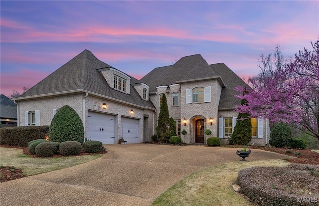 french country inspired facade with a garage