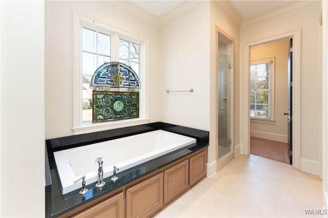 bathroom featuring plenty of natural light, ornamental molding, independent shower and bath, and tile patterned flooring