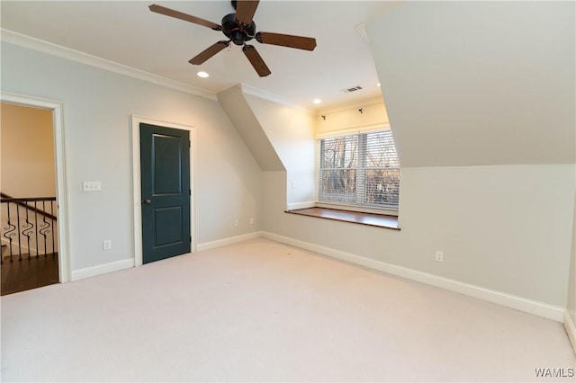 bonus room with carpet floors and ceiling fan