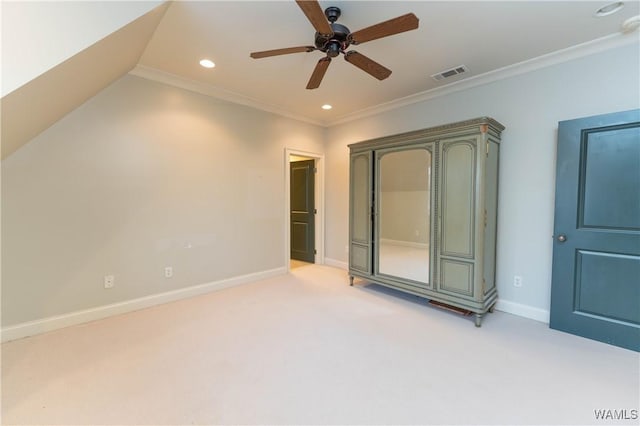 unfurnished bedroom with ceiling fan, crown molding, light carpet, and vaulted ceiling