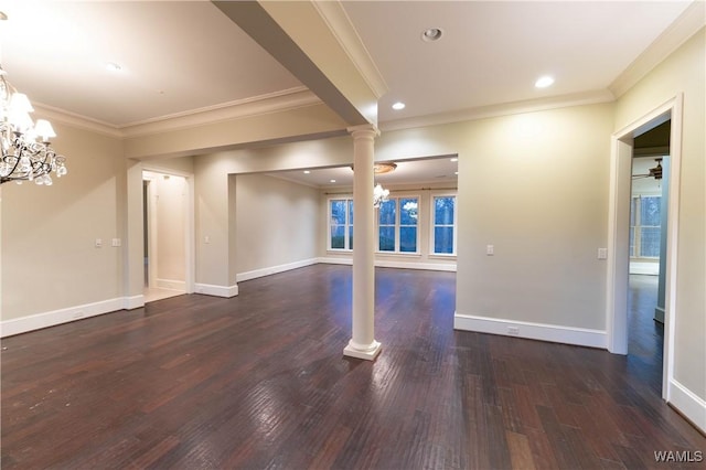 interior space featuring decorative columns, dark hardwood / wood-style flooring, crown molding, and ceiling fan with notable chandelier