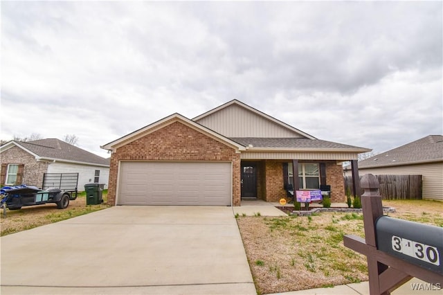 single story home featuring a garage, fence, concrete driveway, and brick siding