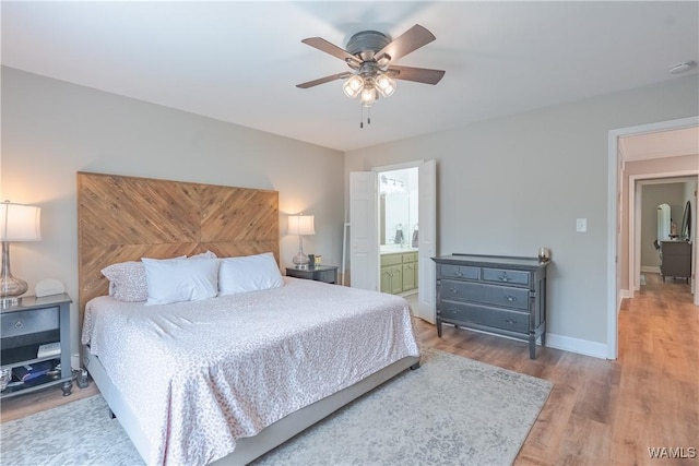 1603 Quail Run Dr, Tuscaloosa, AL 35406 - bedroom with wood finished floors, a ceiling fan, baseboards, and ensuite bath