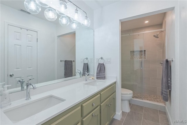 1603 Quail Run Dr, Tuscaloosa, AL 35406 - full bathroom featuring toilet, a shower stall, double vanity, tile patterned flooring, and recessed lighting