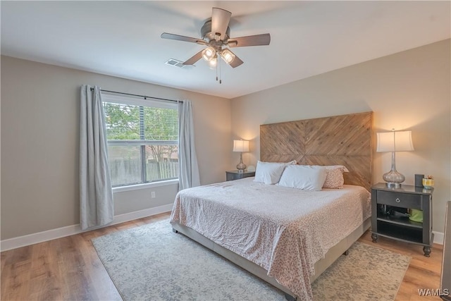 1603 Quail Run Dr, Tuscaloosa, AL 35406 - bedroom with baseboards, light wood finished floors, and a ceiling fan