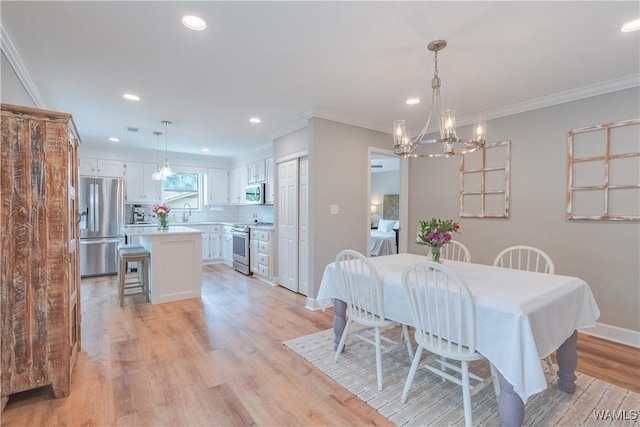 1603 Quail Run Dr, Tuscaloosa, AL 35406 - dining space featuring a chandelier, crown molding, light wood-style flooring, recessed lighting, and baseboards