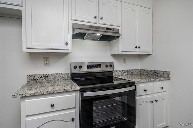 kitchen featuring white cabinetry, stainless steel electric stove, and light stone countertops