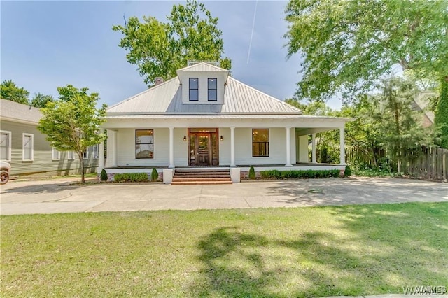 view of front of property with covered porch and a front lawn