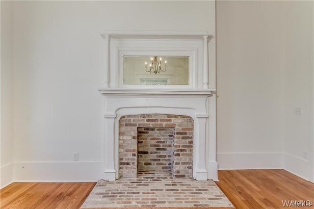 room details featuring a chandelier and hardwood / wood-style flooring