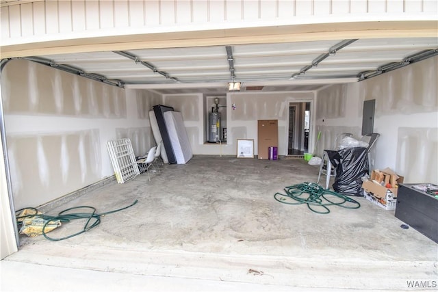 garage featuring a garage door opener, electric panel, and water heater