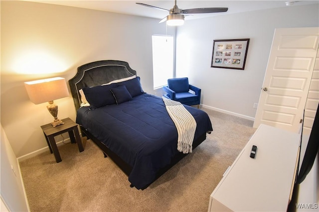 bedroom featuring ceiling fan and light colored carpet