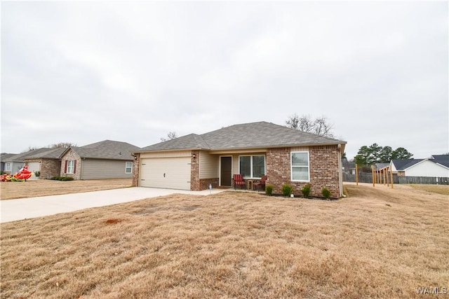 single story home featuring a front yard and a garage