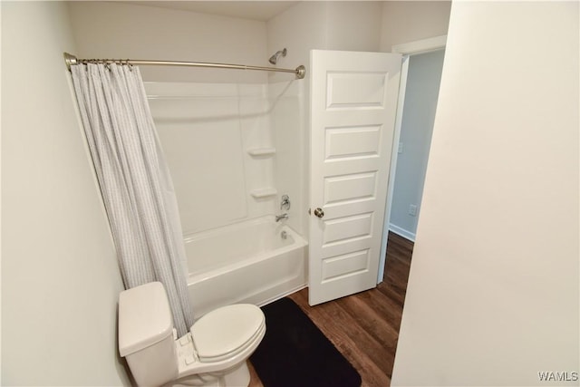 bathroom with hardwood / wood-style flooring, toilet, and shower / tub combo