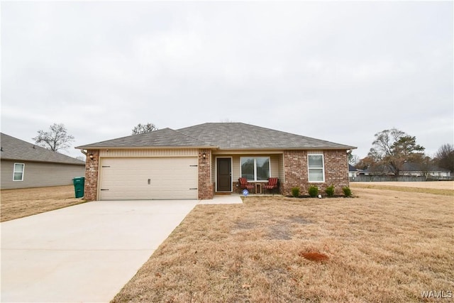 view of front of house featuring a garage and a front lawn