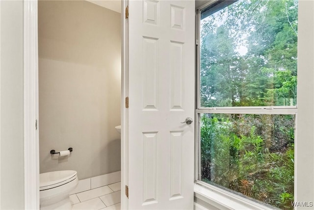 bathroom with tile patterned floors and toilet