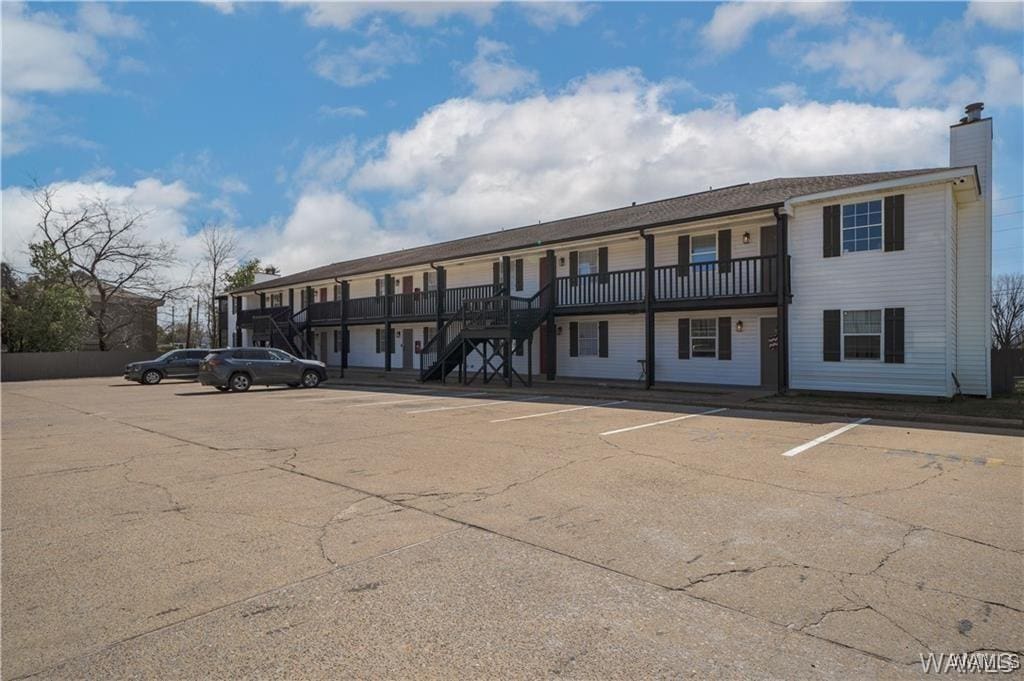 2031 8th Ave Unit 204, Tuscaloosa, AL 35401 - view of building exterior featuring uncovered parking