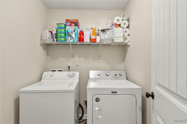 clothes washing area with laundry area and independent washer and dryer