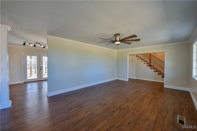 unfurnished living room with stairway, ornamental molding, dark wood finished floors, and french doors