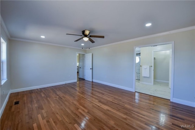 empty room with ceiling fan, recessed lighting, baseboards, wood-type flooring, and crown molding