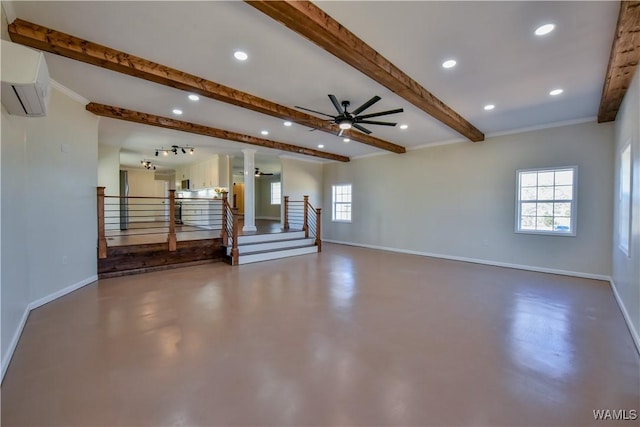 unfurnished living room with finished concrete flooring, baseboards, a wealth of natural light, and a wall mounted air conditioner