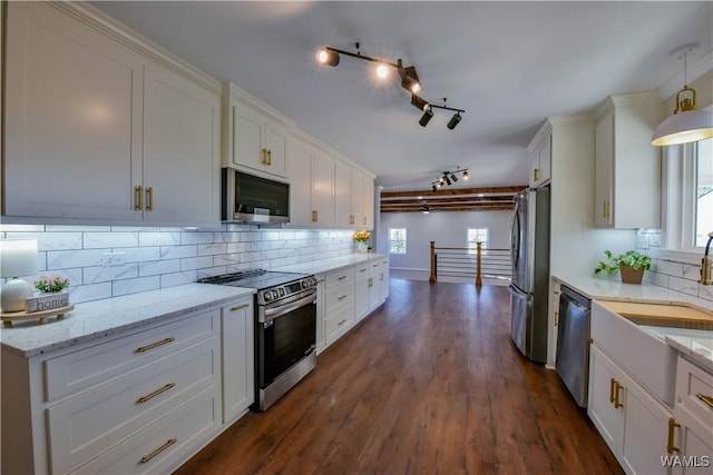 kitchen featuring white cabinetry, tasteful backsplash, and appliances with stainless steel finishes