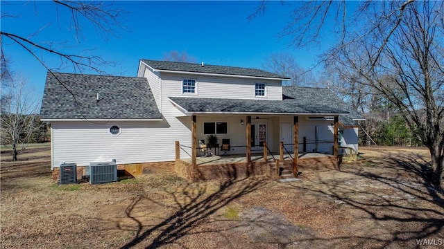 back of house with cooling unit, french doors, a patio area, and roof with shingles