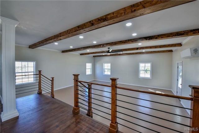 hall with plenty of natural light, beamed ceiling, dark wood-style flooring, and an upstairs landing