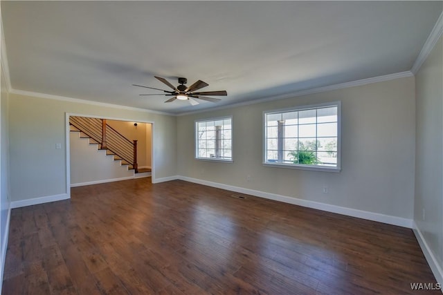 unfurnished room with baseboards, stairway, dark wood finished floors, and crown molding