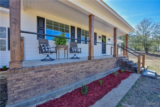 doorway to property with covered porch