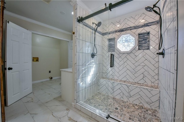 bathroom with marble finish floor, a shower stall, ornamental molding, and baseboards