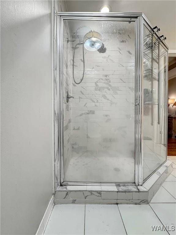 bathroom with a shower with shower door