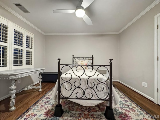 bedroom with dark wood-type flooring, ornamental molding, and ceiling fan