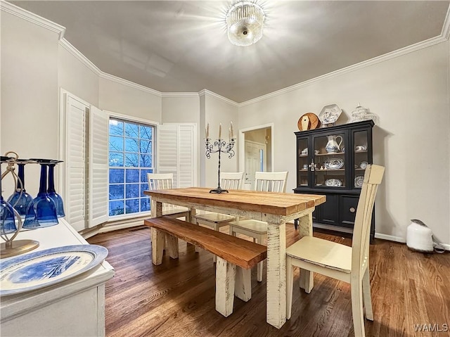 dining space with crown molding and dark hardwood / wood-style floors