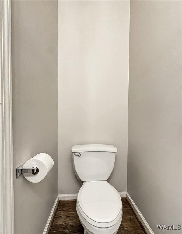 bathroom featuring toilet and hardwood / wood-style floors