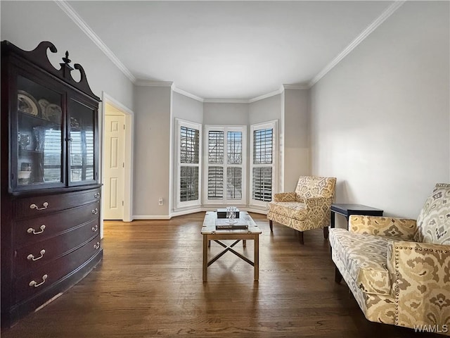 sitting room with crown molding and dark hardwood / wood-style flooring